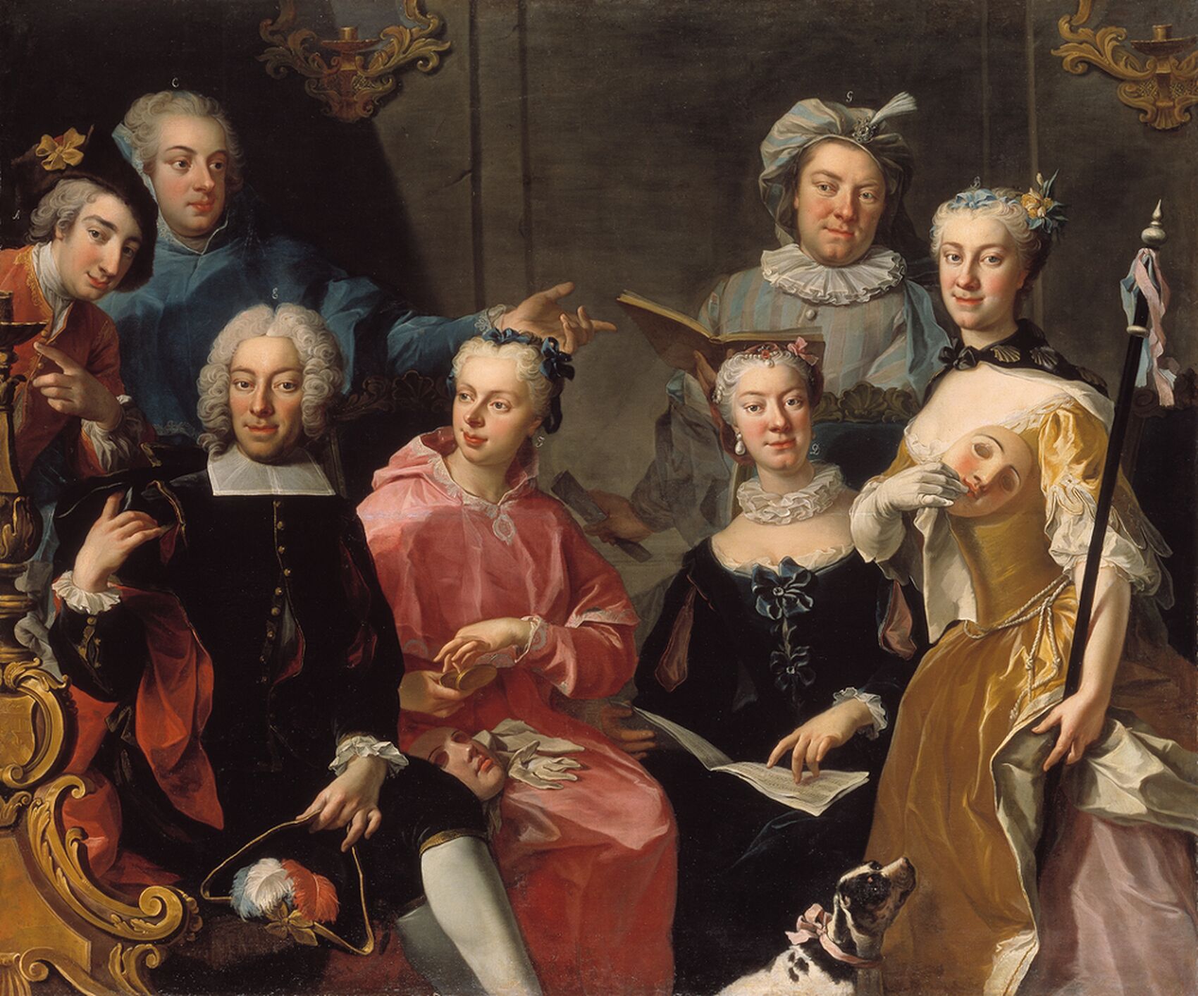 Seven people sitting or a family portrait.