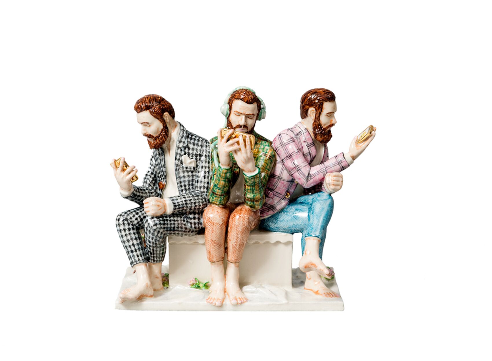 Three men sitting down holding their smartphones